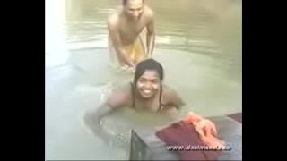 Young girl bathing in river with boob press Video